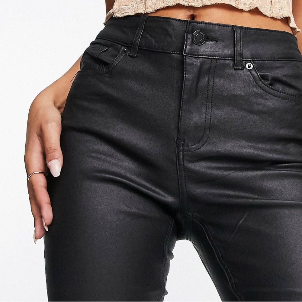 Leather flared jeans in black.